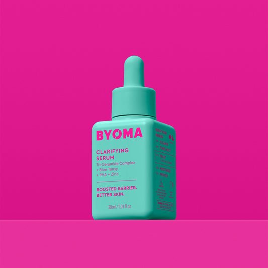 A BYOMA Clarifying Serum in a teal bottle with a dropper cap. 
