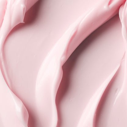 Smooth, creamy pink skincare product with soft curves.
