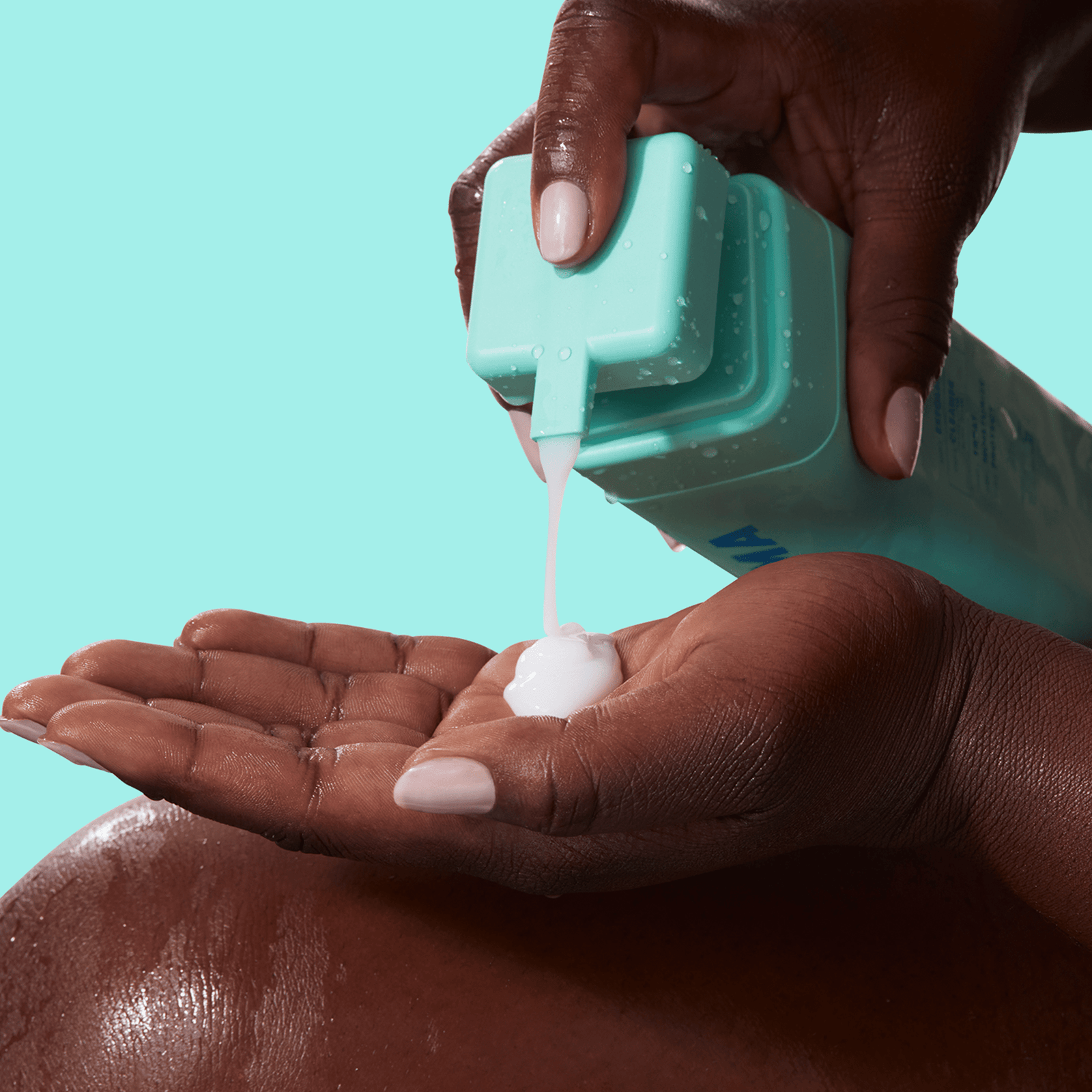 A person dispensing BYOMA body wash onto their hand.