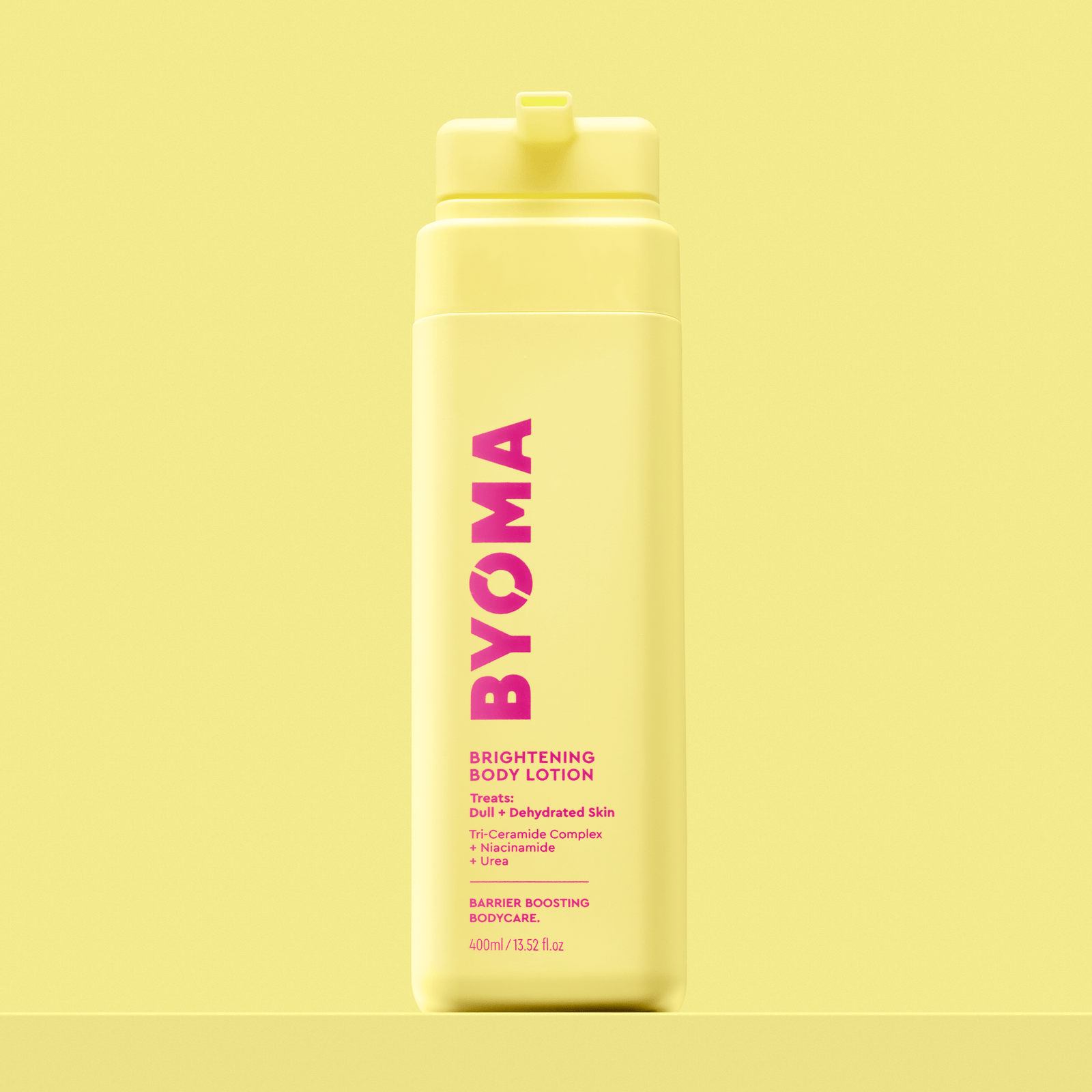BYOMA Brightening Body Lotion in a yellow bottle. 