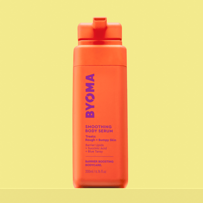 BYOMA Smoothing Body Serum in a bright orange bottle.