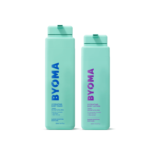 Two turquoise BYOMA products shown isolated on a transparent background.: Hydrating Body Wash (left) with blue text and Hydrating Body Lotion (right) with purple text. Both bottles are upright.