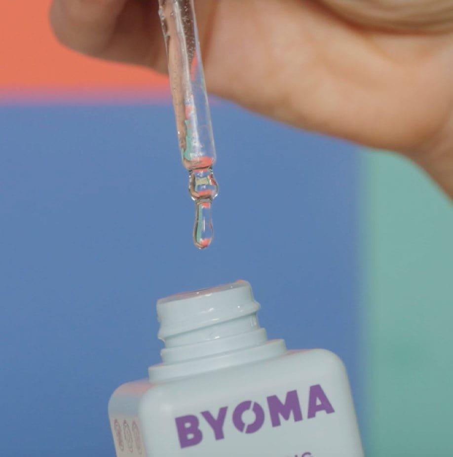 Dropper dispensing BYOMA Hydrating Serum into the bottle.