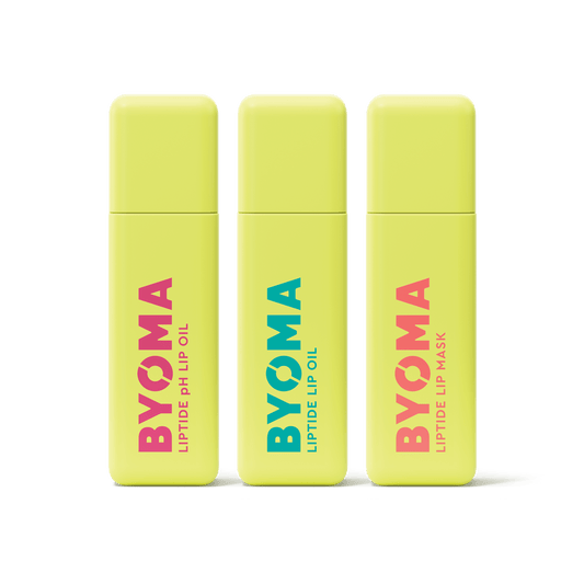 Three BYOMA Liptide lip treatments – pH Lip Oil, Lip Oil, and Lip Mask in yellow tubes against transparent background